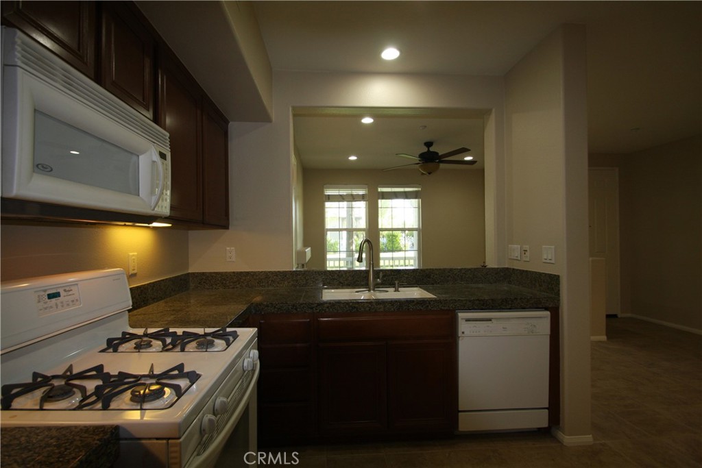 11 Rumford Street Ladera Ranch, CA 92694 - Photo 7 of 24 a kitchen that has a sink and a stove