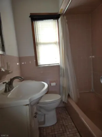 a bathroom with a toilet and a sink