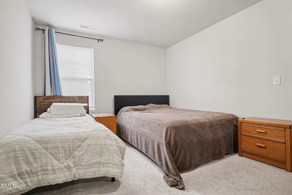 a bedroom with a bed and a cabinets