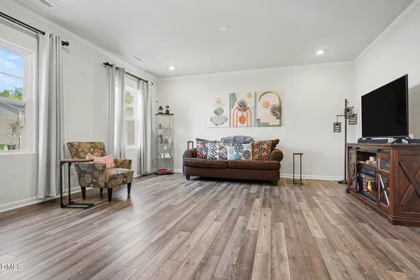 a view of a livingroom with furniture and a flat screen tv