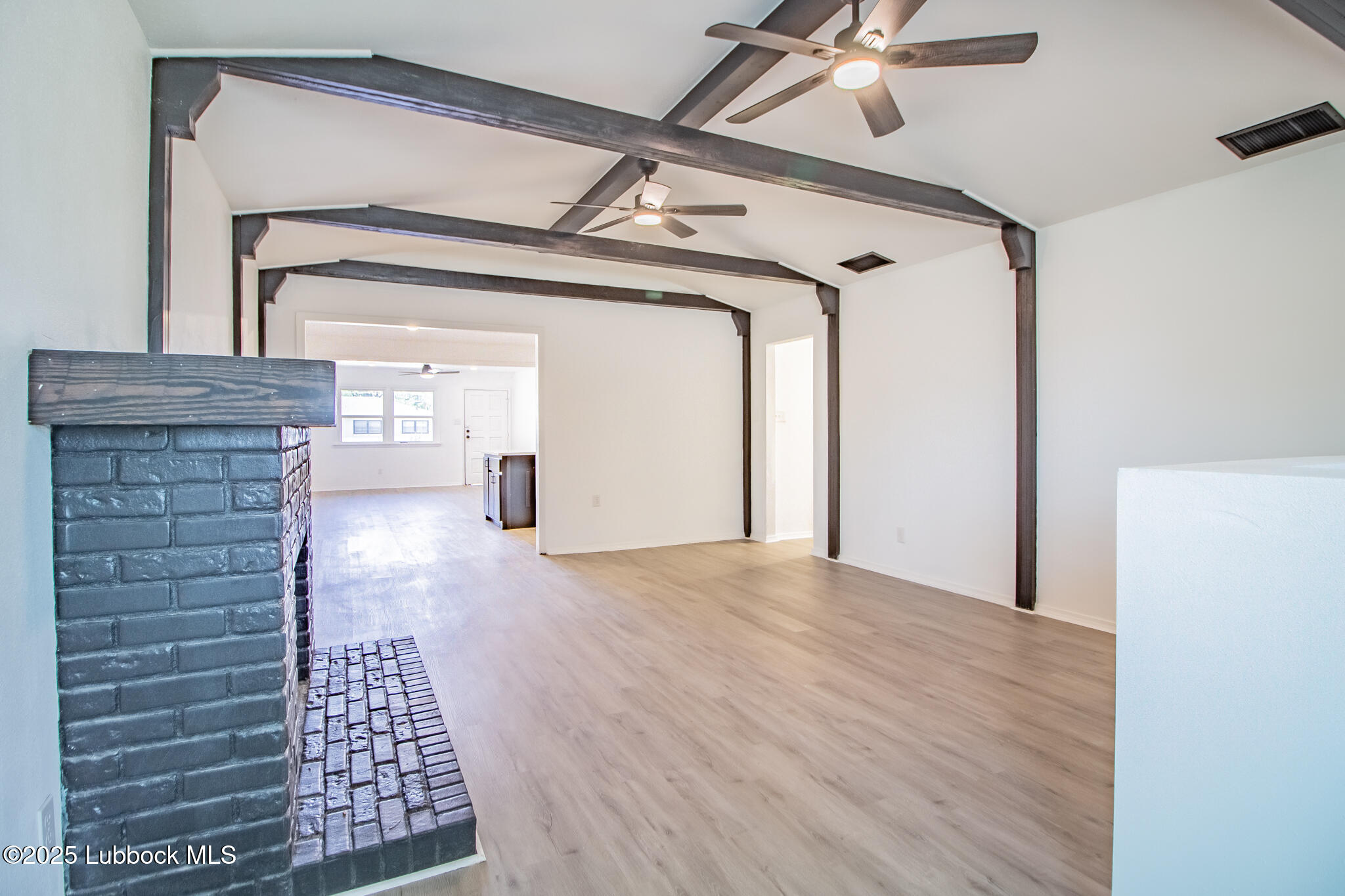 5313 39th Street Lubbock, TX 79414 - Photo 14 of 30 a view of empty room with wooden floor