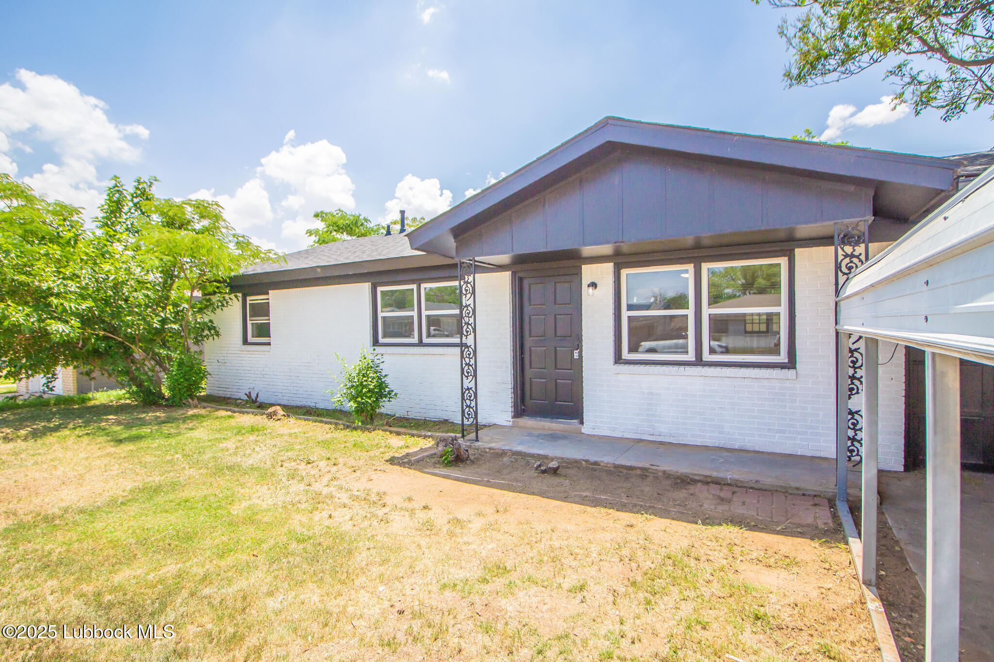 5313 39th Street Lubbock, TX 79414 - Photo 3 of 30 a front view of a house with a yard and garage