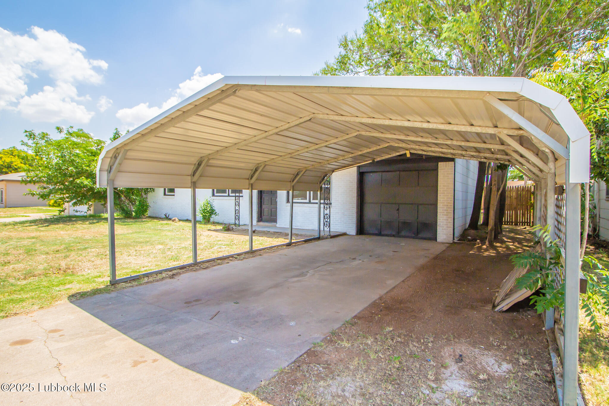 5313 39th Street Lubbock, TX 79414 - Photo 4 of 30 a view of a house with backyard and sitting area
