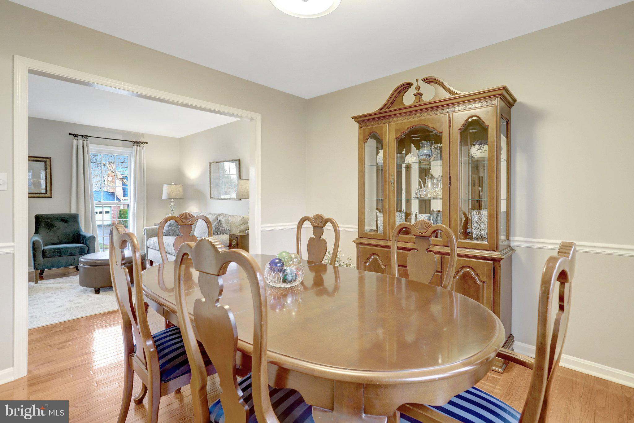 8705 Side Saddle Road Springfield, VA 22152 - Photo 14 of 73 a dining room with furniture and wooden floor