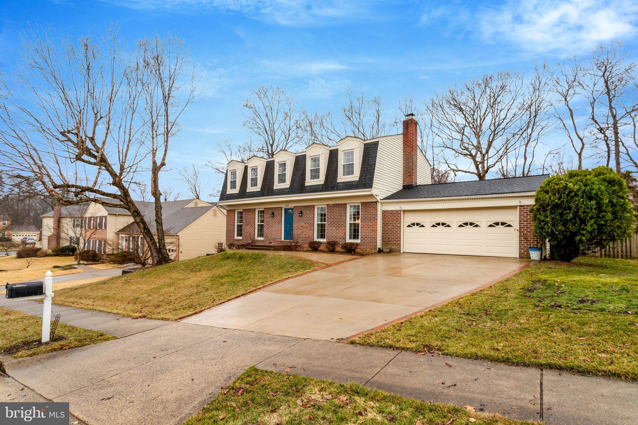 8705 Side Saddle Road Springfield, VA 22152 - Photo 2 of 73 a front view of a house with garden