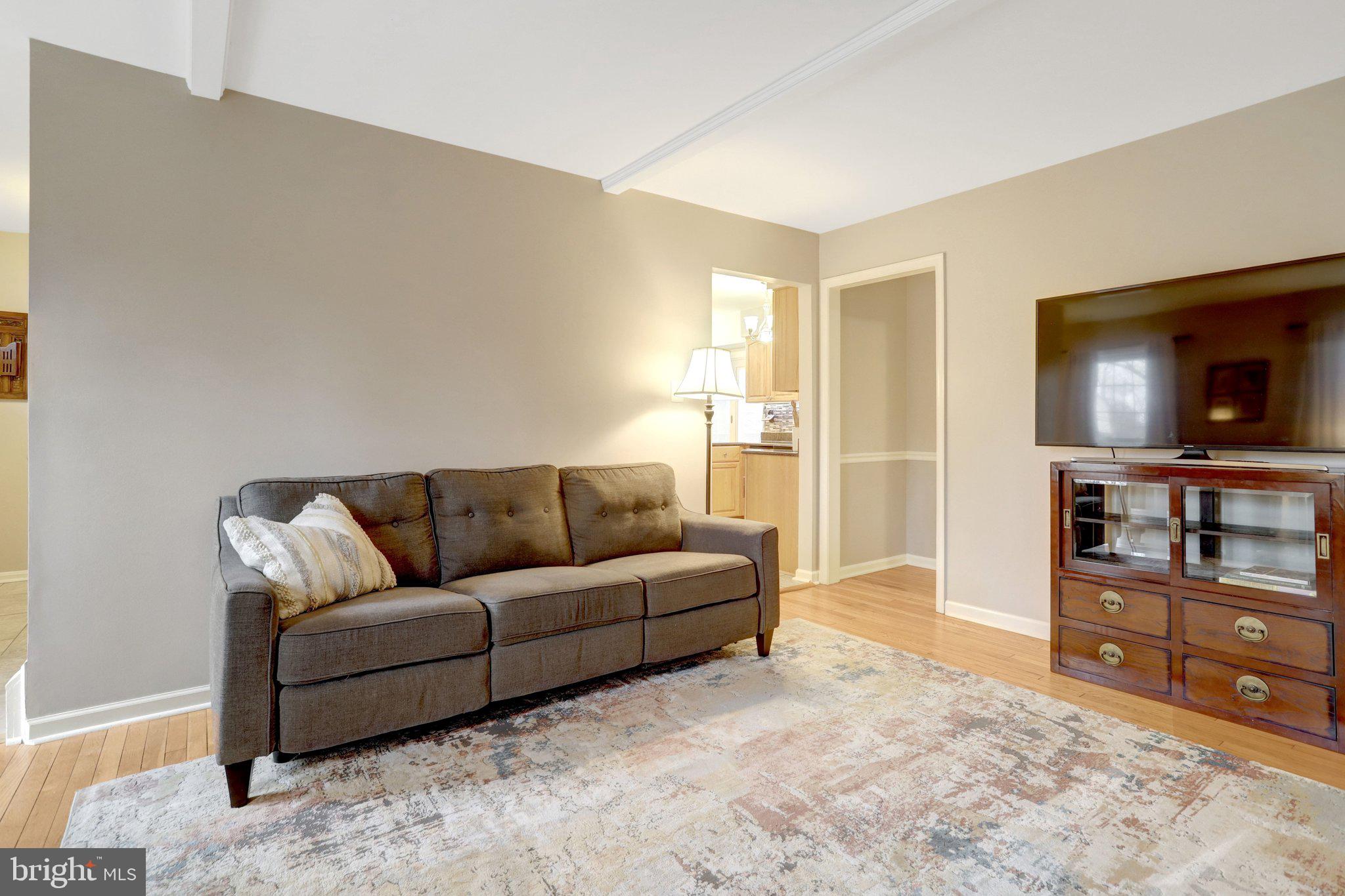 8705 Side Saddle Road Springfield, VA 22152 - Photo 26 of 73 a living room with furniture and a flat screen tv