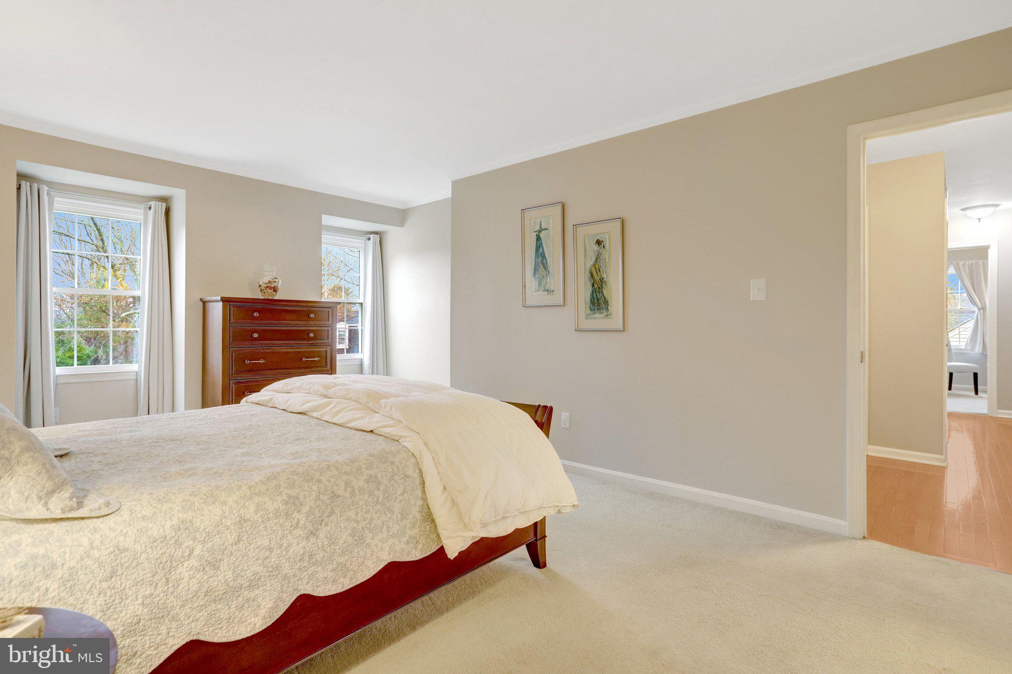 8705 Side Saddle Road Springfield, VA 22152 - Photo 32 of 73 a bedroom with a bed and wooden floor