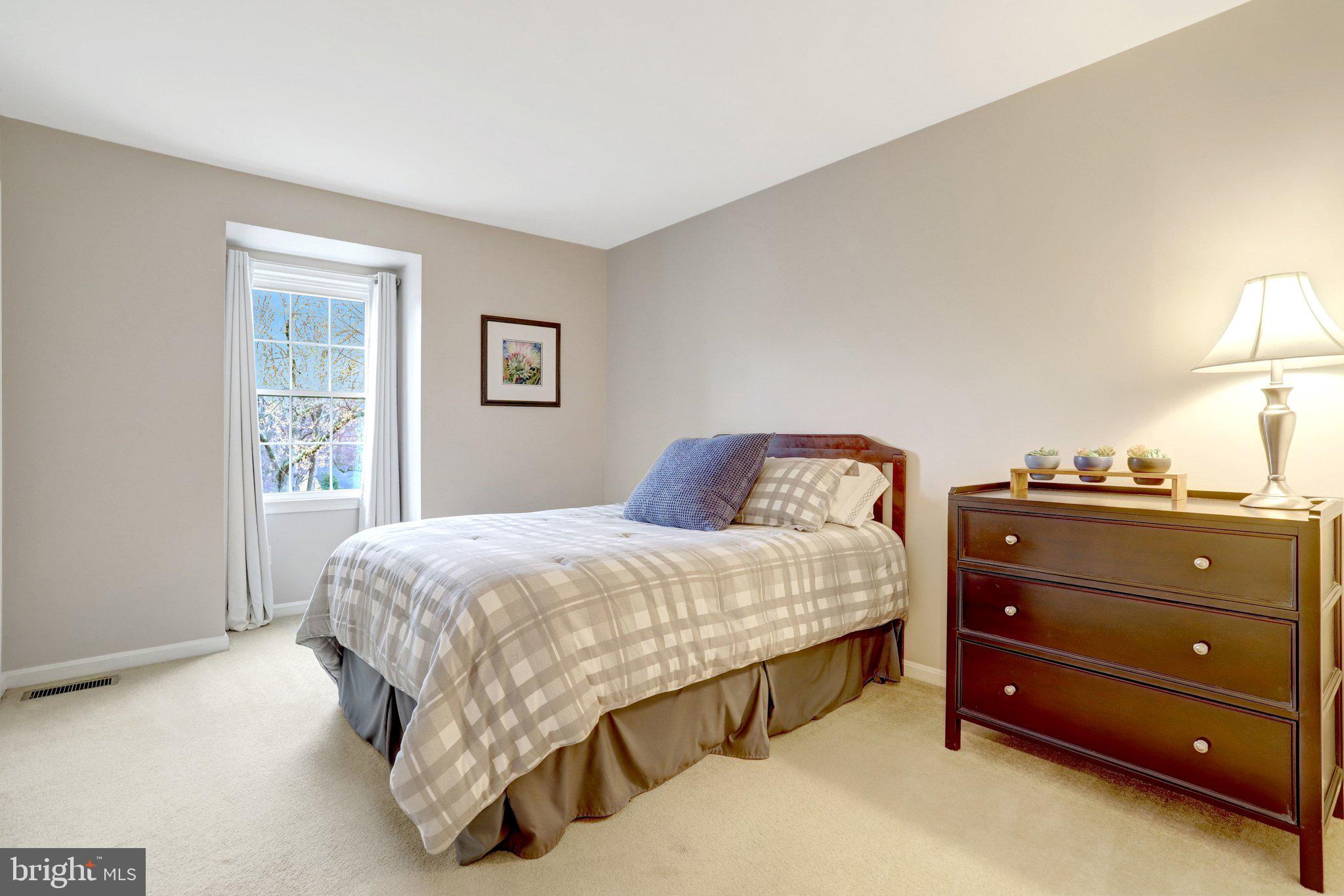 8705 Side Saddle Road Springfield, VA 22152 - Photo 35 of 73 a bedroom with a bed and a window
