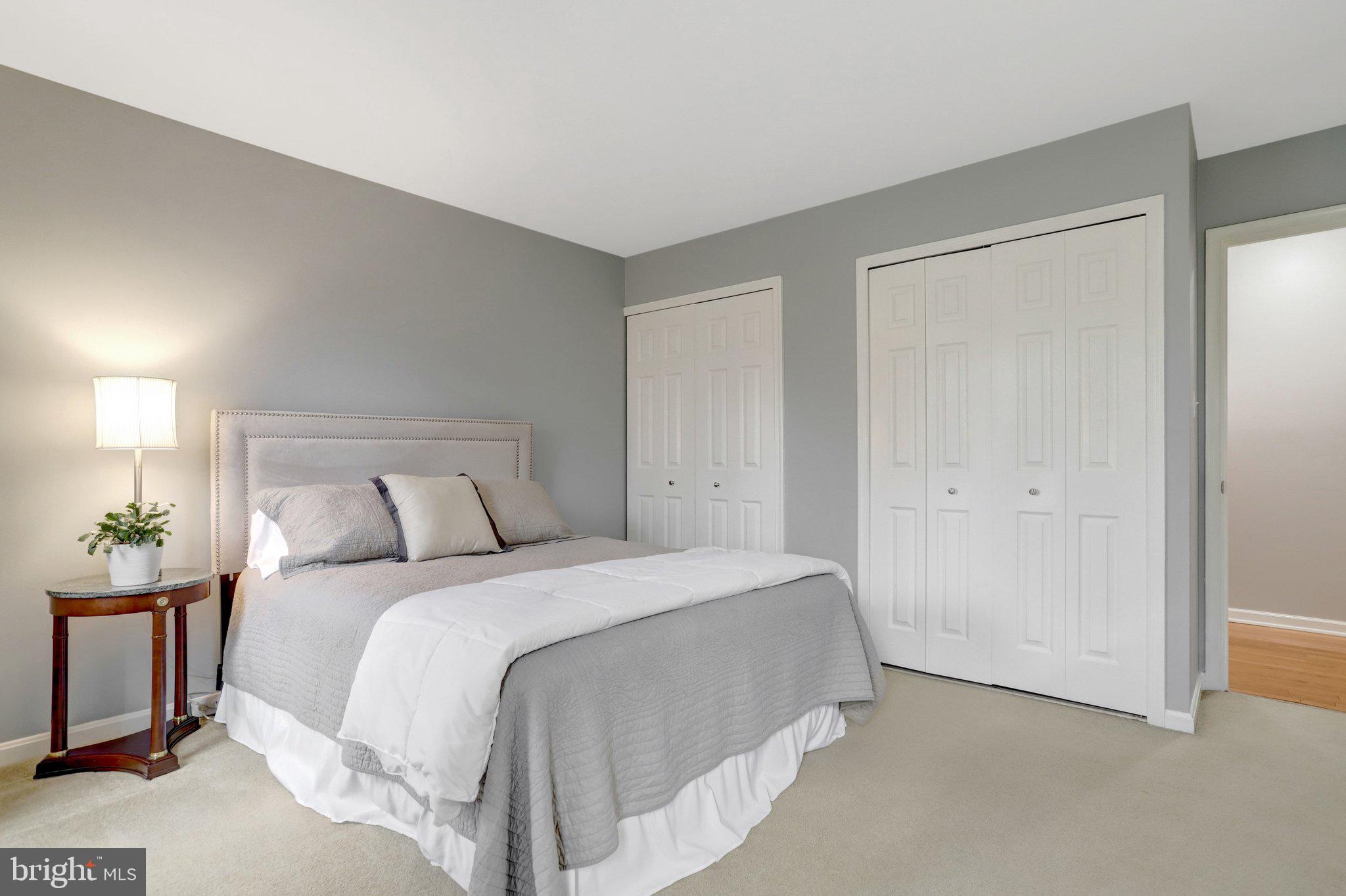 8705 Side Saddle Road Springfield, VA 22152 - Photo 39 of 73 a bed room with a bed and a night stand