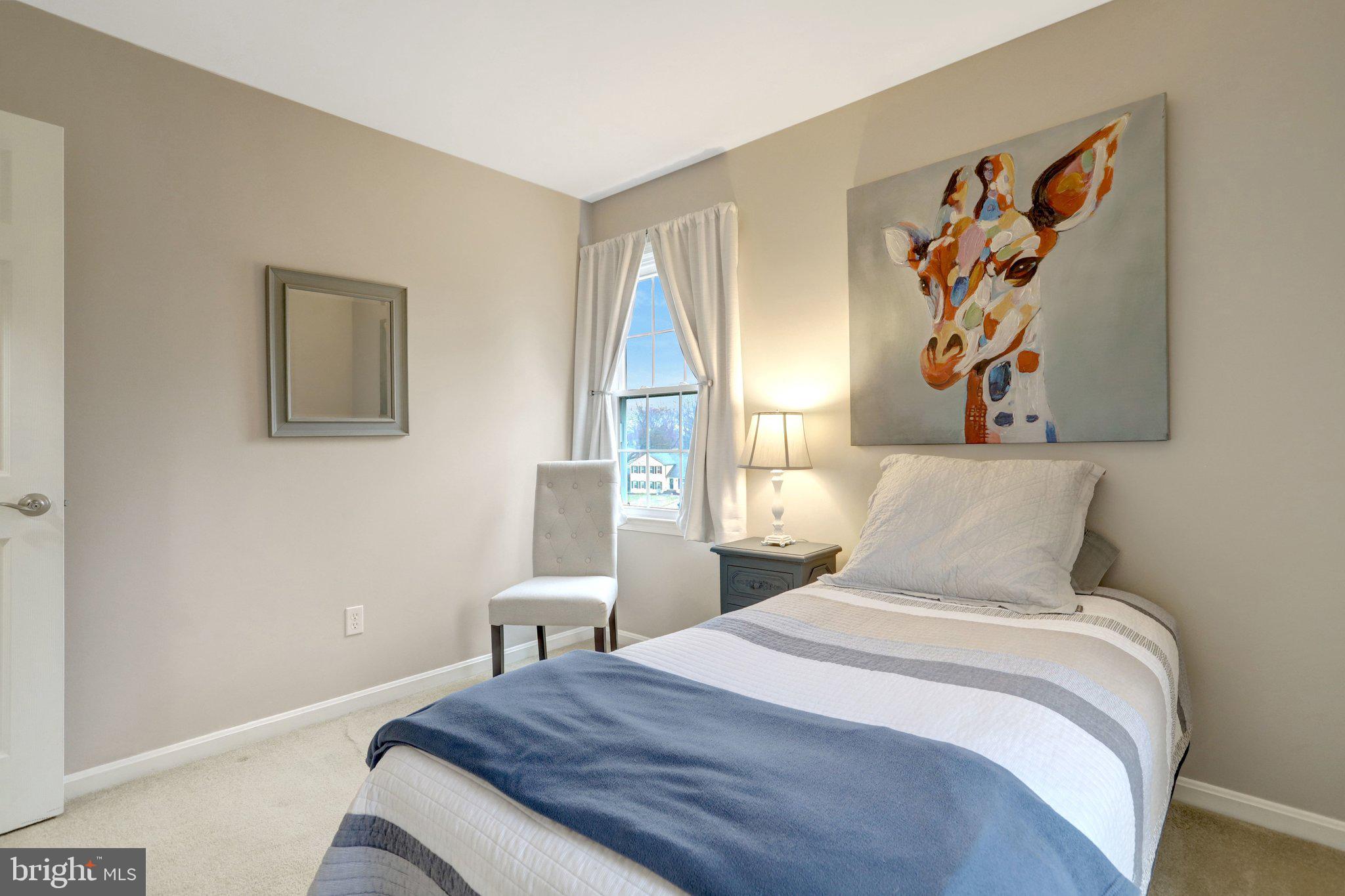 8705 Side Saddle Road Springfield, VA 22152 - Photo 45 of 73 a bedroom with a bed and a painting on the wall