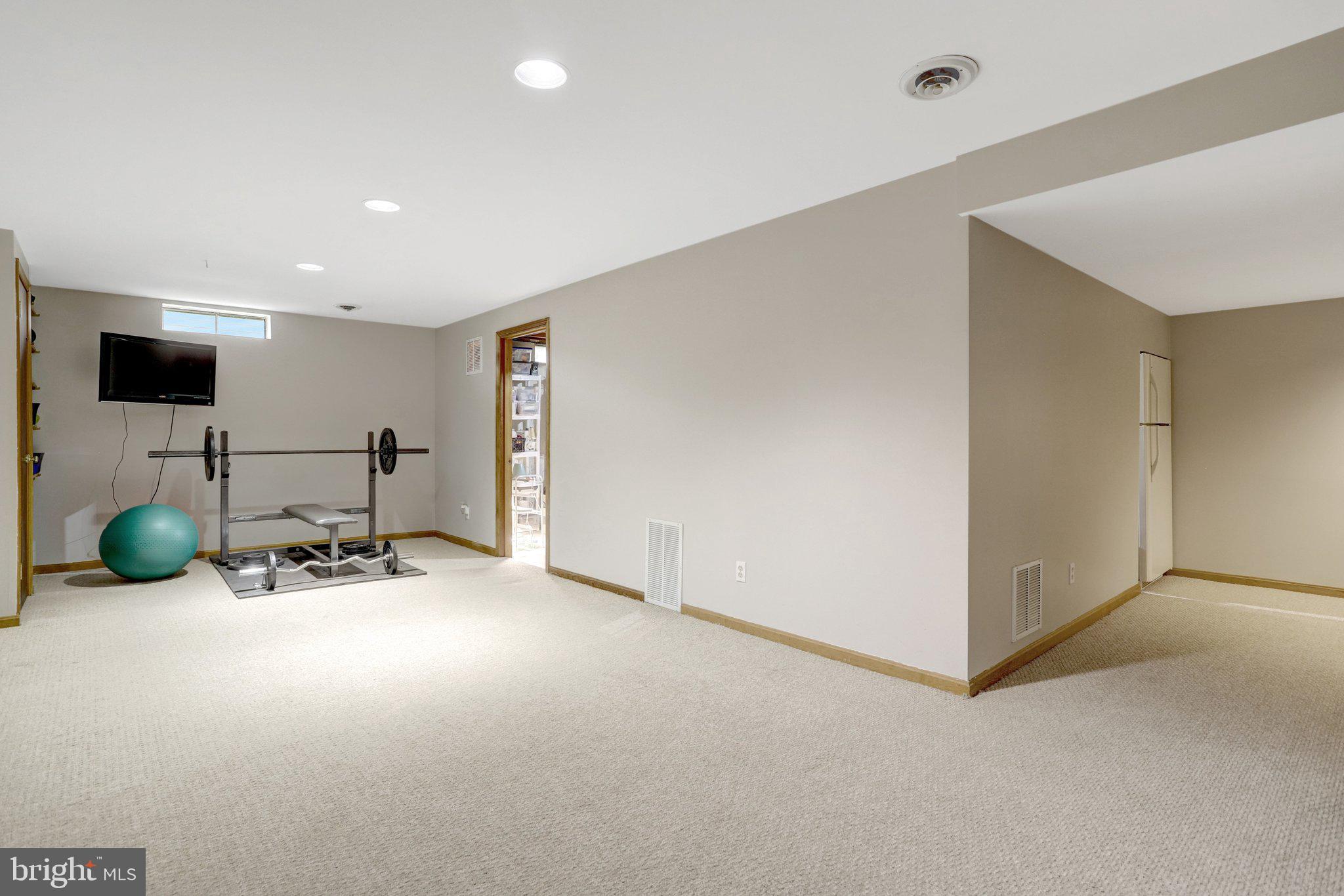 8705 Side Saddle Road Springfield, VA 22152 - Photo 54 of 73 a room with furniture and tv