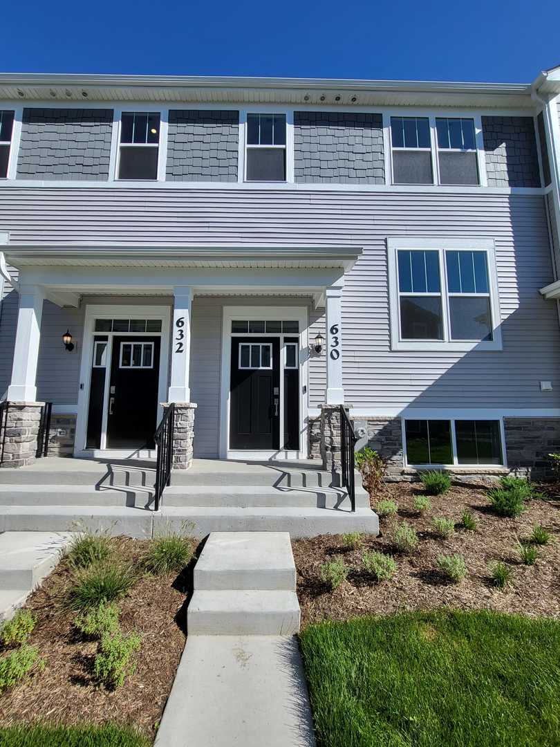630 Wolverine Drive Aurora, IL 60502 - Photo 1 of 21 a front view of a house with yard and seating area