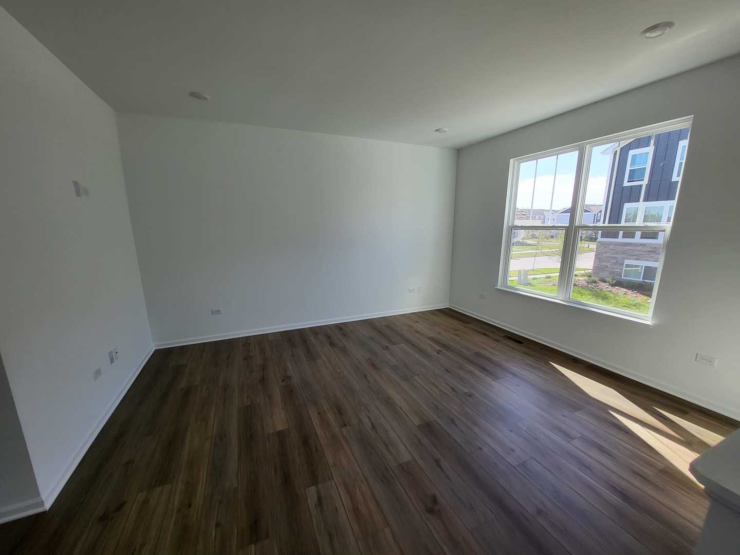 630 Wolverine Drive Aurora, IL 60502 - Photo 21 of 21 wooden floor in an empty room with a window