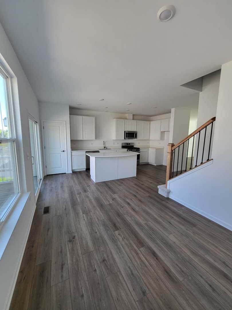 630 Wolverine Drive Aurora, IL 60502 - Photo 6 of 21 a view of kitchen with sink and wooden floor