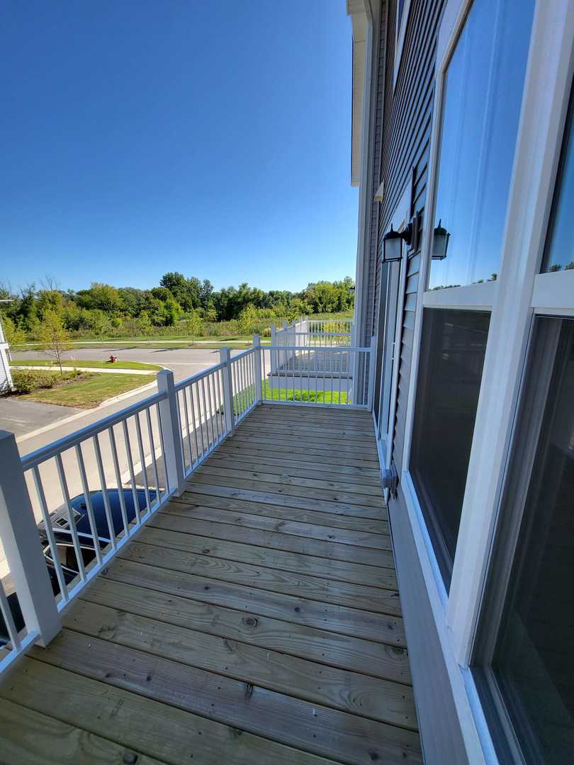 630 Wolverine Drive Aurora, IL 60502 - Photo 9 of 21 a view of balcony with hardwood floor