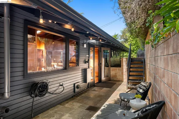 a patio with table and chairs