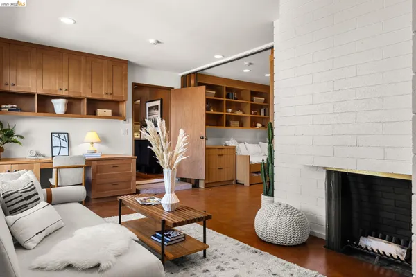 a room with wooden floor and furniture