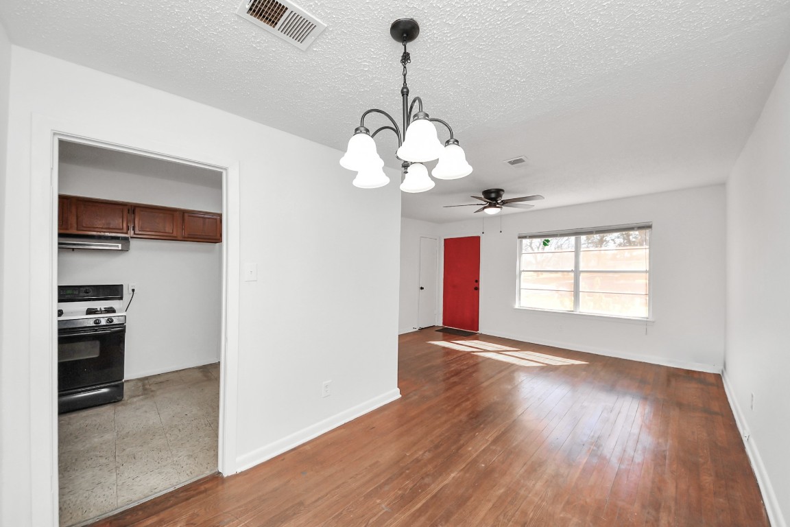 201 Delta Street Pasadena, TX 77506 - Photo 11 of 33 a view of an empty room with wooden floor and a window
