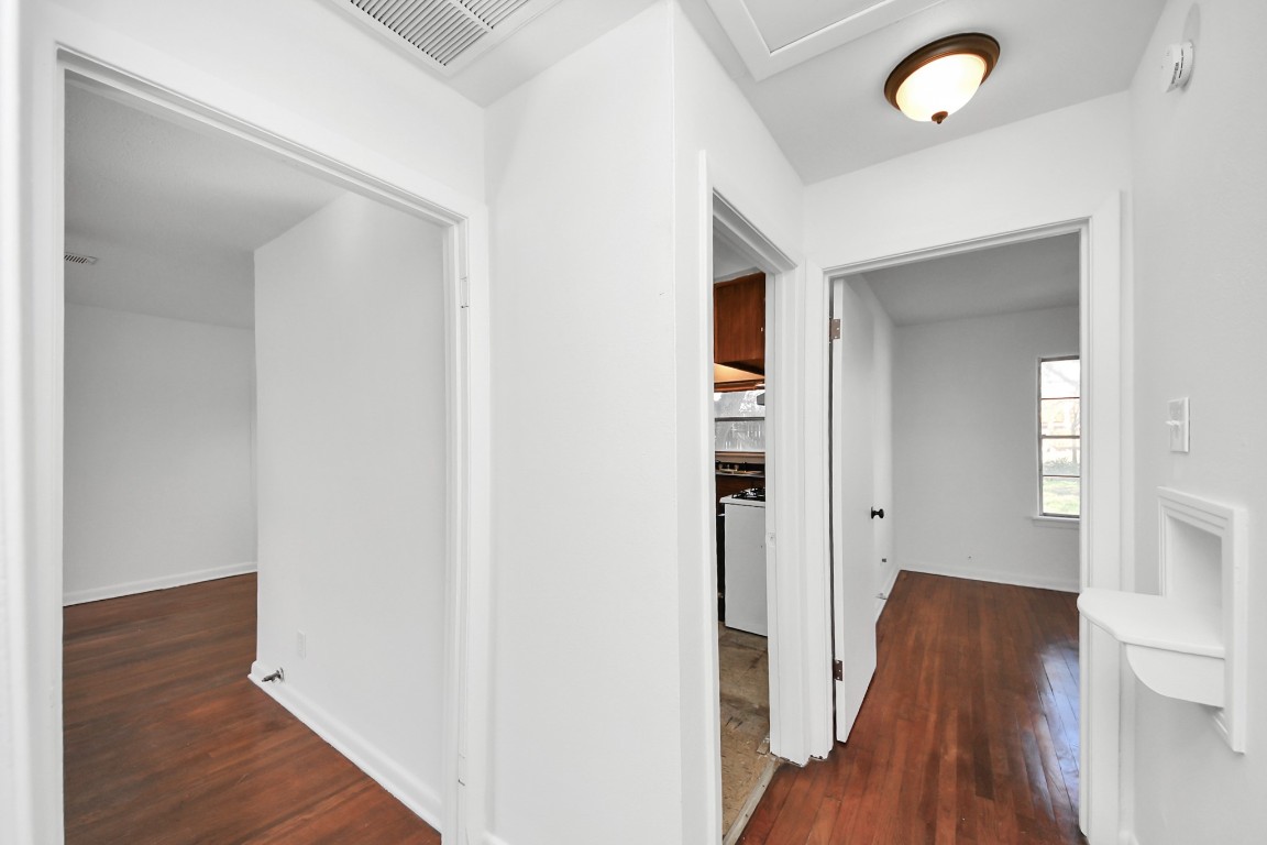 201 Delta Street Pasadena, TX 77506 - Photo 23 of 33 a view of a hallway with wooden floor