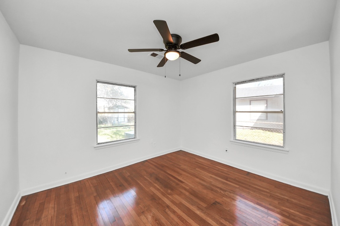 201 Delta Street Pasadena, TX 77506 - Photo 24 of 33 a view of empty room with wooden floor and fan