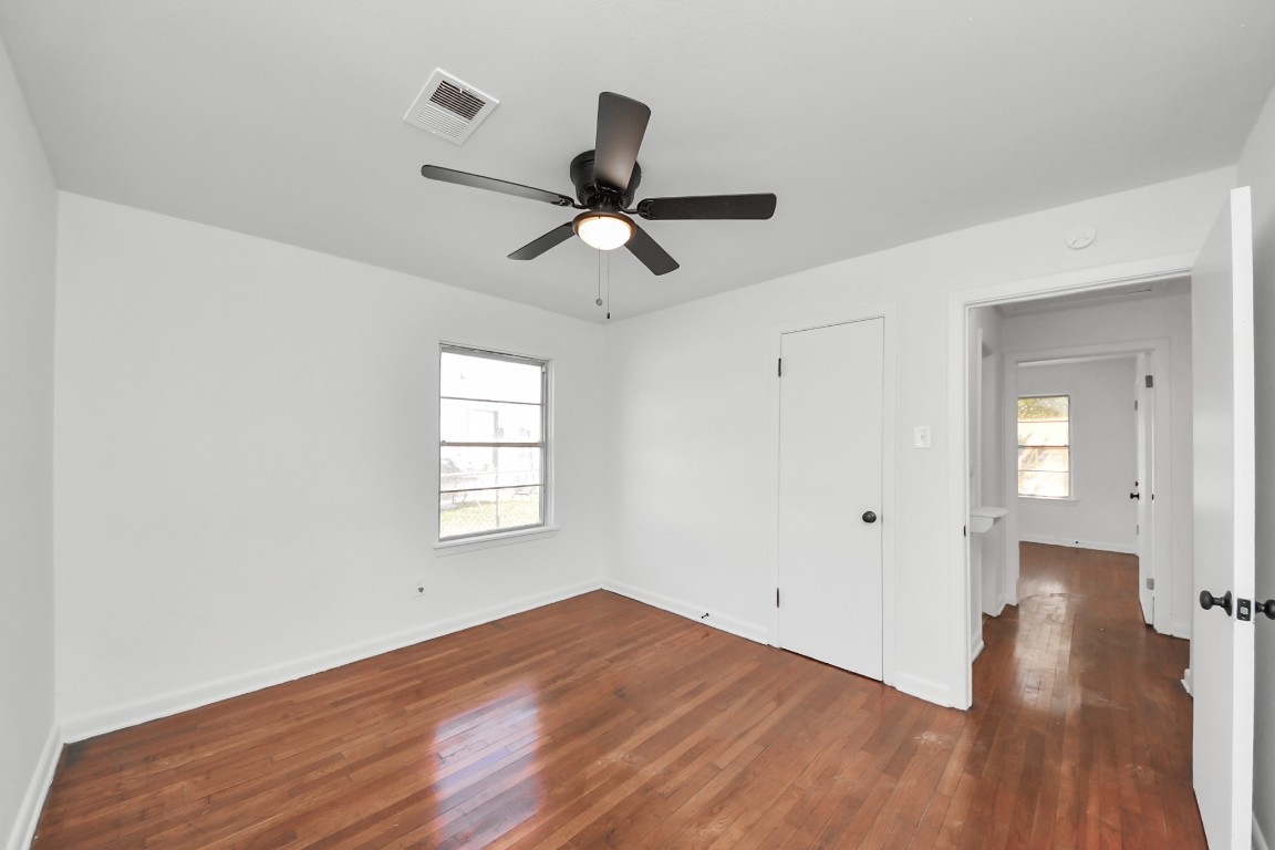 201 Delta Street Pasadena, TX 77506 - Photo 26 of 33 a view of empty room with wooden floor and fan