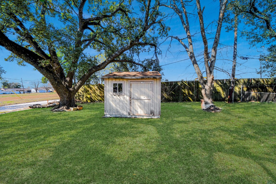 201 Delta Street Pasadena, TX 77506 - Photo 27 of 33 a view of a backyard with large trees