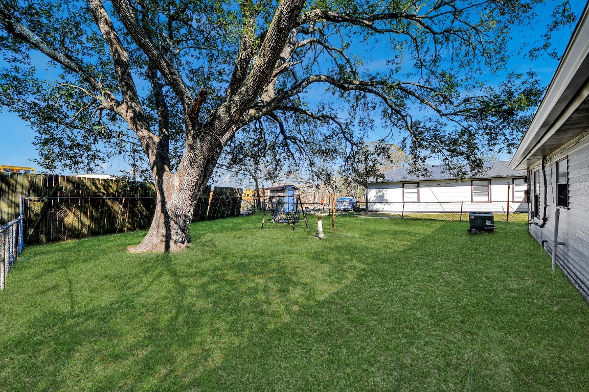 201 Delta Street Pasadena, TX 77506 - Photo 28 of 33 a view of a house with a back yard