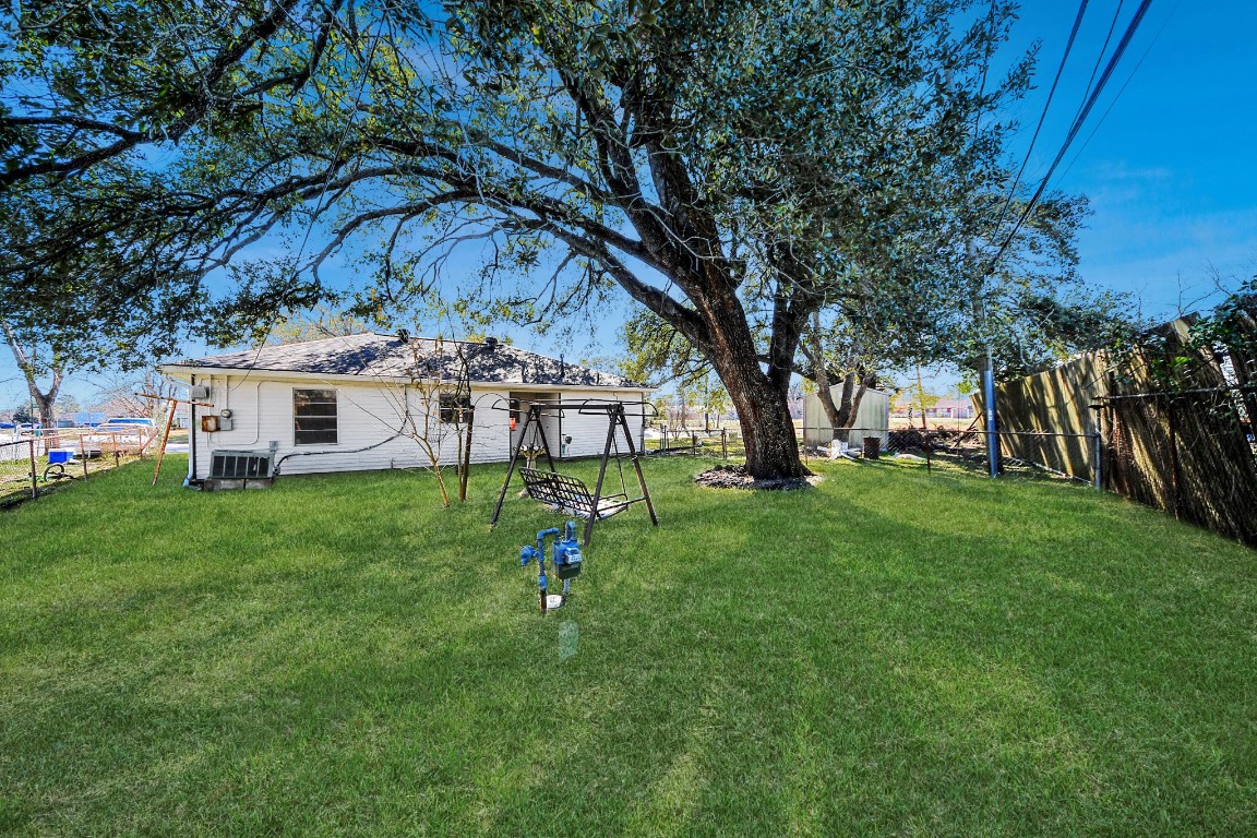 201 Delta Street Pasadena, TX 77506 - Photo 29 of 33 a view of a house with a backyard