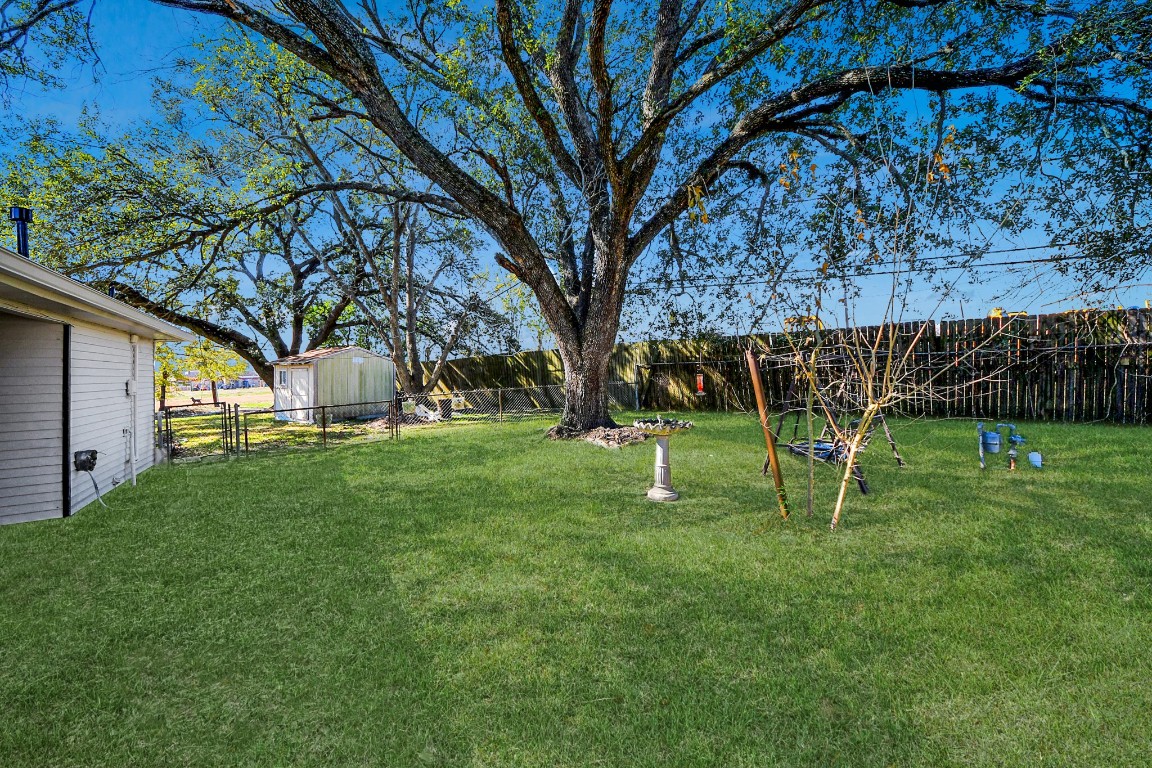 201 Delta Street Pasadena, TX 77506 - Photo 30 of 33 a view of a house with a backyard