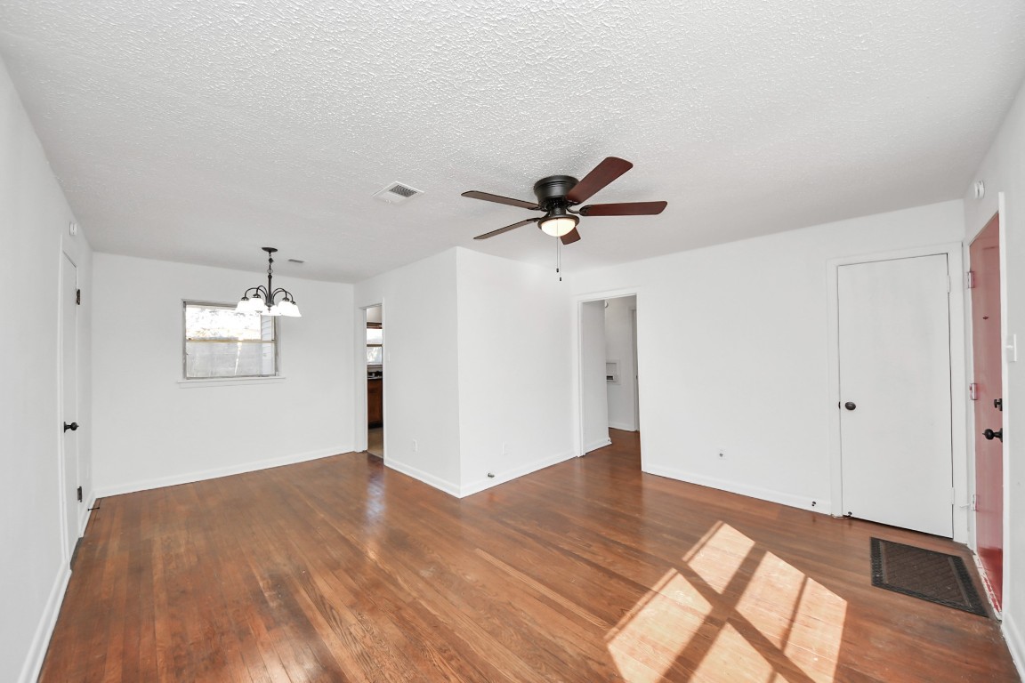 201 Delta Street Pasadena, TX 77506 - Photo 7 of 33 a view of empty room with wooden floor and ceiling fan