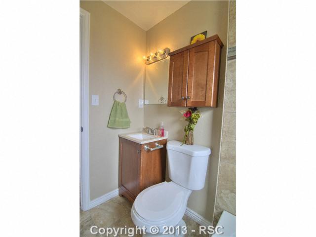 10865 Falling Star Road Fountain, CO 80817 - Photo 18 of 23 Completely remodeled custom tile work throughout, warm neutral paint.
