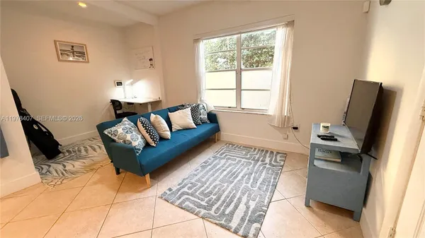 a living room with furniture and a window