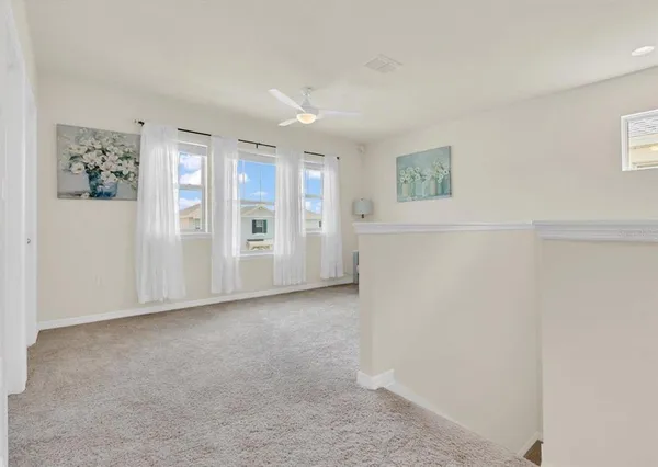 a view of an empty room with a cabinet