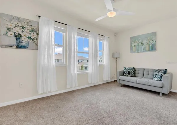 a living room with furniture and a window