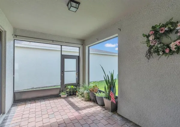 a view of entryway with flower pots