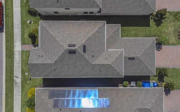 an aerial view of residential houses with outdoor space