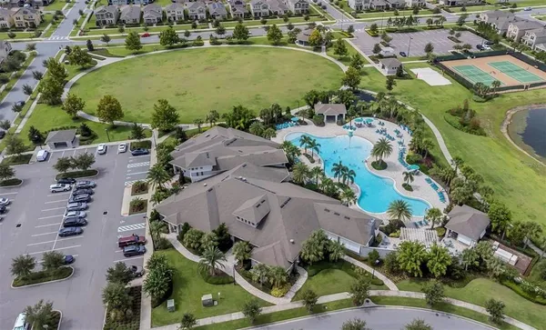 an aerial view of residential houses with outdoor space