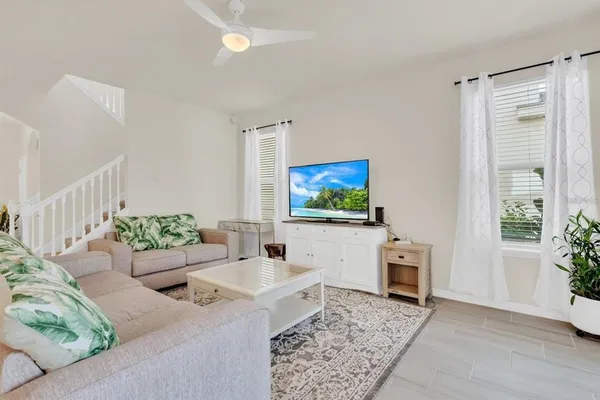 a living room with furniture and a flat screen tv