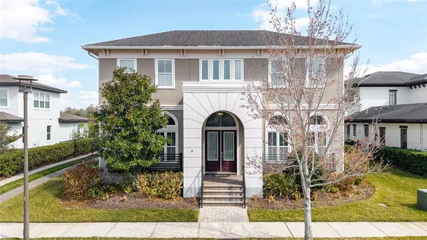 a front view of a house with garden