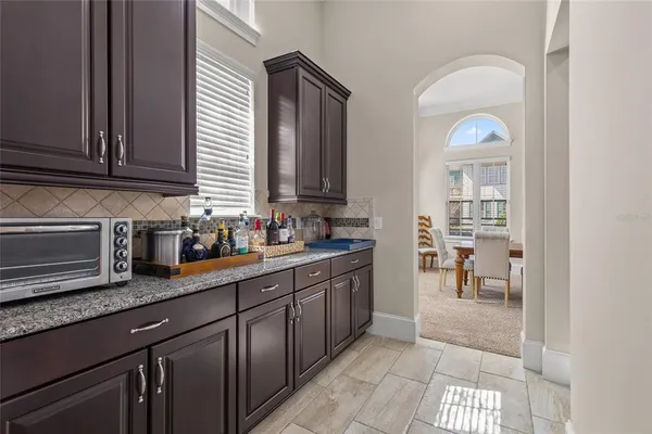 a view of kitchen with furniture and staircase