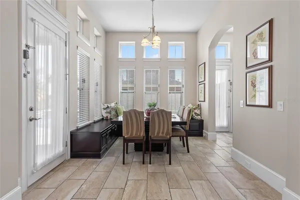 a view of a hallway with entryway and living room