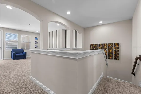 a bedroom with a bed couch and window