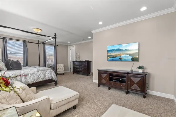 a spacious bathroom with a tub sink and mirror