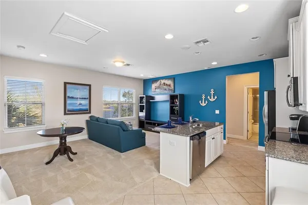 a living room with furniture and a rug