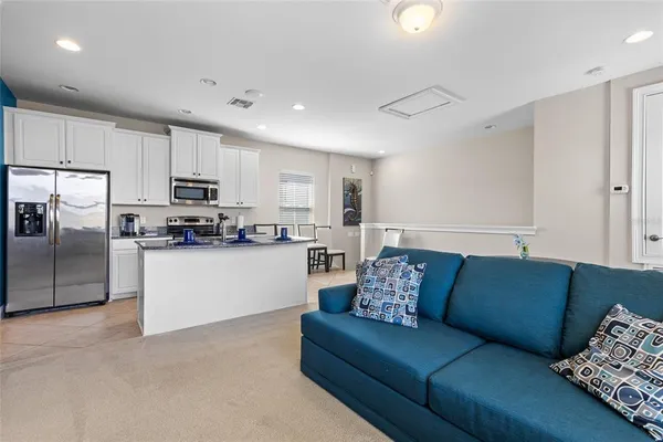 a bedroom with a bed and a couch