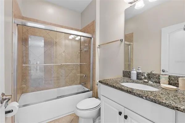 an aerial view of a house with outdoor space and lake view