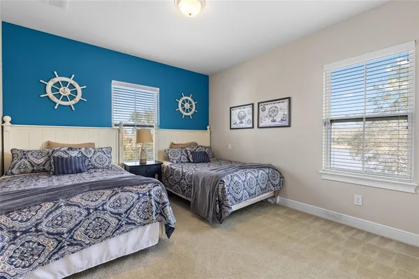 an aerial view of residential houses with outdoor space and swimming pool