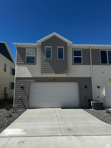 15 South Lunar Way Mapleton, UT 84664 - Photo 2 of 13 Traditional-style house with a garage, concrete driveway, and stucco siding