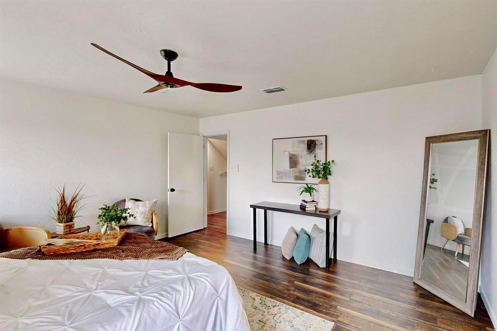 3965 Singleleaf Lane Fort Worth, TX 76133 - Photo 21 of 39 Spacious room featuring wood-finish flooring, a modern ceiling fan, and white walls