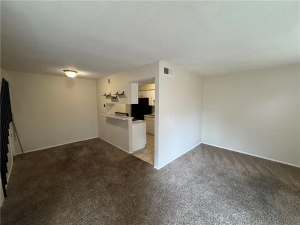 a kitchen with a sink and refrigerator